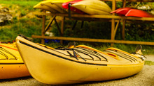 Kayaks On Water Shore. Rental Area