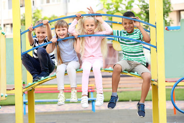 Poster - Cute little children on playground