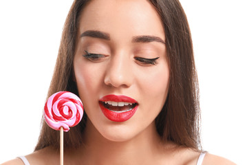 Canvas Print - Beautiful young woman with bright lipstick and lollipop on white background