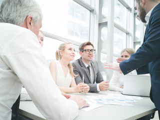 Wall Mural - Business people discussing diagrams