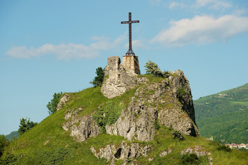 Cross at the hill over of the medieval town of Pennabilly, Italy.