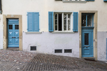 vintage european style building facade with door and windows in Zurich, Switserland