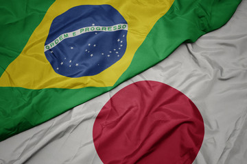 Wall Mural - waving colorful flag of japan and national flag of brazil.