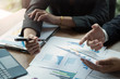© Natee Meepian - Business people are meeting for analysis data figures to plan business strategies. Business Corporate Organization Meeting Concept