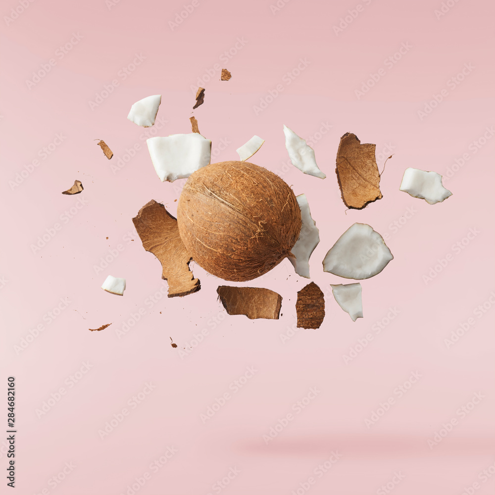 Fresh ripe coconut isolated on pink background - obrazy, fototapety, plakaty 