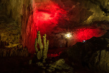 Yellow Stalagmites On A Red Background In The Cave Of Prometheus, Georgia