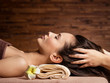 © Valua Vitaly - Masseur doing massage the head and hair for an woman in spa salon