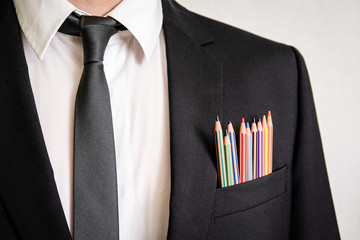 Wall Mural - Man in a suit with pencils in front pocket. Business, office, skill, education and back to school concept
