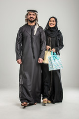 Poster - ARabian couple isolated on grey background