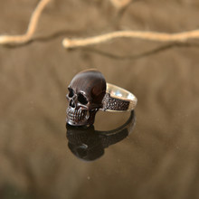 Wood And Silver Jewelry In The Shape Of A Skull