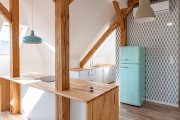 Kitchen in loft apartment with vintage old style fridge