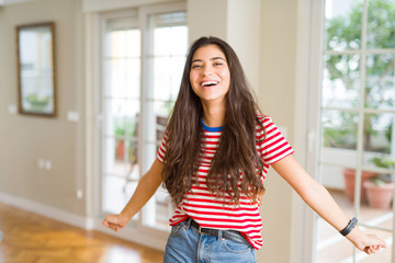 Beautiful young woman celebrating excited for success, screaming and smiling for winning