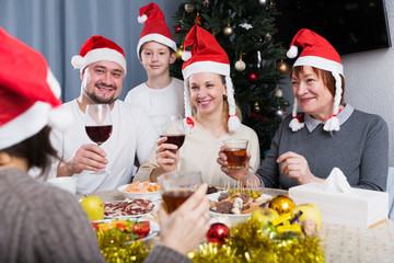 Family at dining table for Christmas dinner