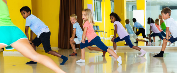 Active young children posing at dance class