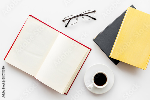 Fotomural Reading books in library with glasses and coffee on white background top view sp
