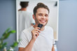 © Kalim - Portrait of adult man shaving in the bathroom