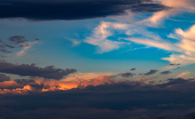 Beautiful sunset sky. Orange, blue, and white sky. Colorful sunrise. Art picture of sky at sunrise. Sunrise and clouds for inspiration background. Nature background. Peaceful and tranquil concept.