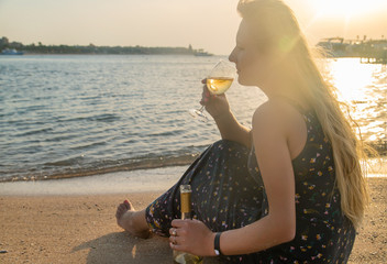 Wall Mural - Drink wine by the sea. Selective focus.