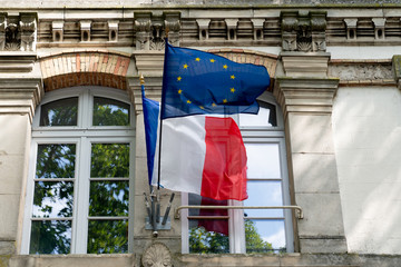 French and EU European Union flags fluttering on the city hall in France