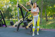 © fotofabrika - Woman working out in an outdoor gym