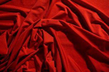 Wall Mural - Background image of crumpled fabric. Red cloth