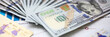 © Тихон Купревич - Big amount of US currency on financial statistics graphs closeup