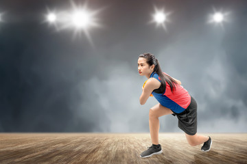 Wall Mural - Asian woman basketball player in action with the ball