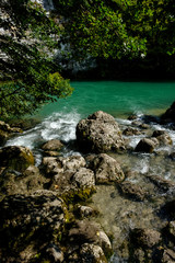 Rolling mountain green river at the cliffs.