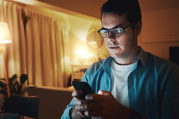 Close-up of a man using mobile phone