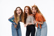 © Drobot Dean - Portrait of three cheerful girls wearing casual clothes laughing and posing at camera together