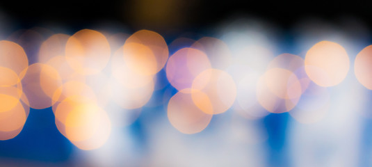 Abstract background with bokeh on dark blue background_