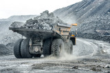 Fototapeta  - Large quarry dump truck. Transport industry.