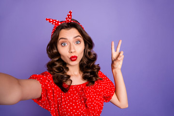 Sticker - Photo of pretty lady making selfies showing v-sign symbol wear red dress isolated purple background