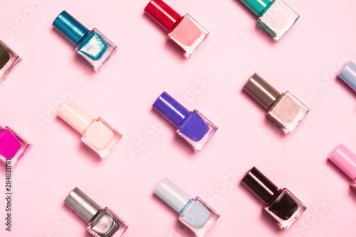 Nail polish bottles pattern background. Close up. Fototapeta