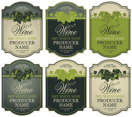 Wall Mural - vector set of labels for white wine with bunches of grapes and calligraphic inscriptions in retro st