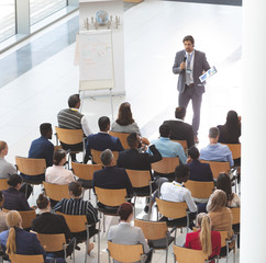 Businessman giving speech at business conference