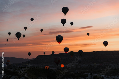 Leinwand Poster  Cappadocia hot air balloon view in dawn, Turkey