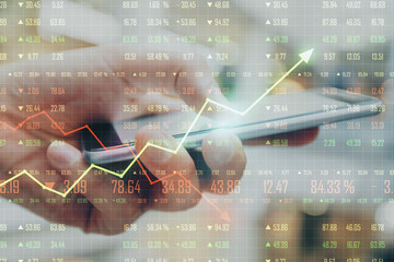 Poster - Trading concept with man using mobile phone and business chart screen.
