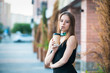 Attractive lovely girl with coffee on the street