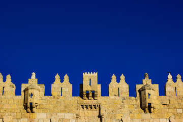 castle symmetry stone wall protection medieval building object background on vivid blue sky with empty space for copy or text