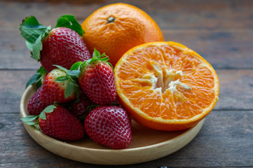 Wall Mural - strawberry and orange fruit vitamin diet for healthy