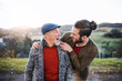 © Halfpoint - Senior father and his son walking in nature, having fun.