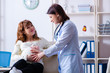 © Elnur - Young pregnant woman visiting experienced doctor gynecologist