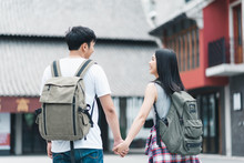 Traveler Asian Backpacker Couple Feeling Happy Traveling In Beijing, China, Cheerful Young Teenager Couple Walking At Chinatown. Lifestyle Backpack Tourist Travel Holiday In City Concept.