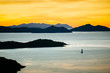 © Tandem Stock - A sailboat on a calm ocean at sunset, Whitsunday Islands, Queensland, Australia