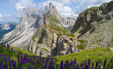 Wall Mural - Panorama of Seceda Mountain Range in South Tyrol partly covered in clouds at sunny day