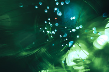 Aufkleber - Beautiful abstract fiber optic network cable on a green bokeh colored glow background.