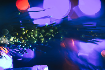 Poster - Beautiful abstract fiber optical network cable on a multi colored glow background.