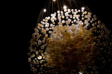 Abstract Shot Of A Chandelier Made Up Of Smaller Globes Illuminated From Above