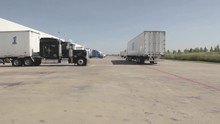 Semi Trucks And 16 Wheelers At A Loading Dock.